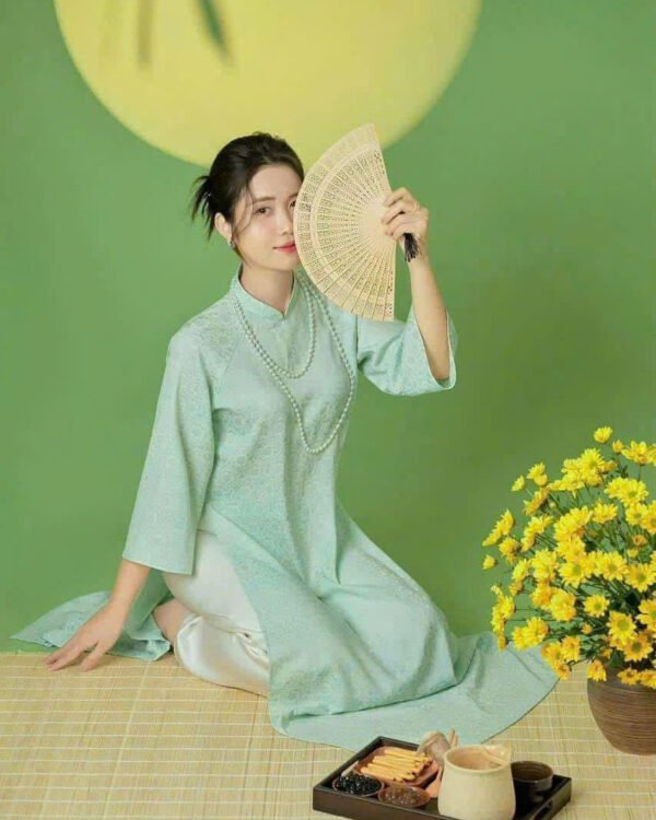 Cho Thuê Áo Dài Cổ Trụ Hoa Chìm Xanh Ngọc